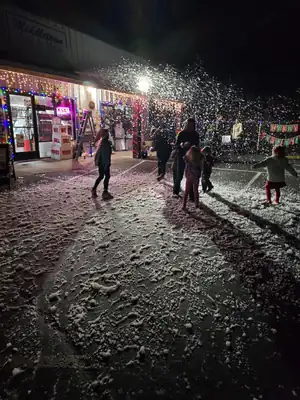 Snow flurries and families enjoying Christmas lights in Middletown