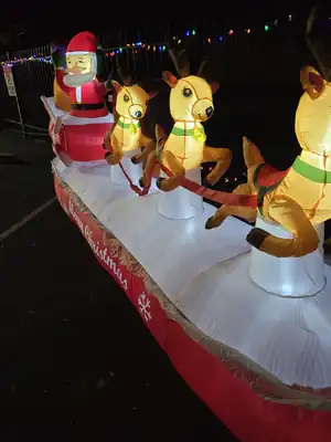 Lighted Santa and reindeer holiday display