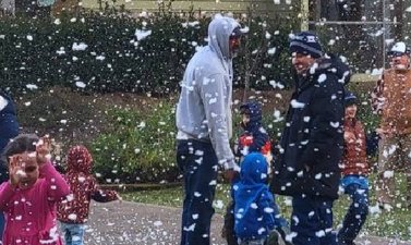Families enjoying the snow at Christmas in Middletown